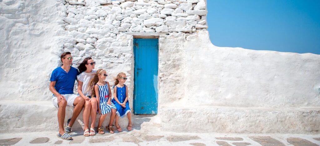 amily having fun outdoors on Mykonos streets